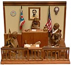 Carved courtroom scene