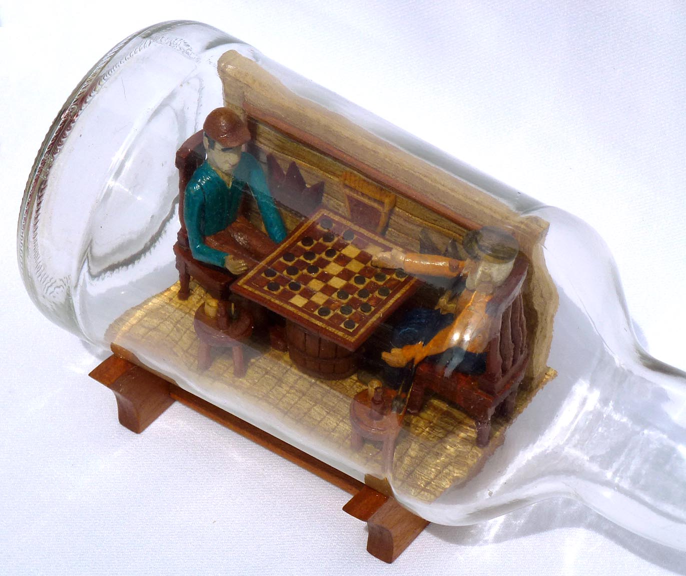 Intricate Bottle Whimsey of Men Playing Checkers