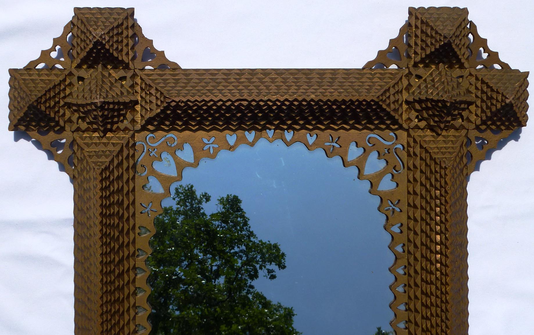 Large, intricate tramp art frame