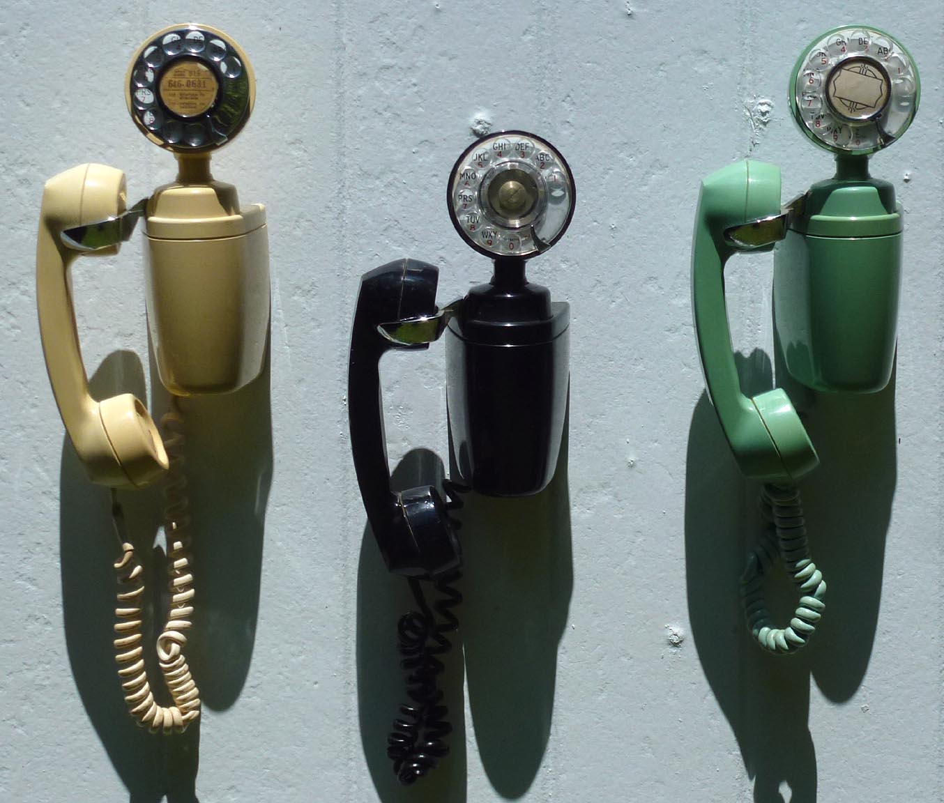 Three decorative telephones