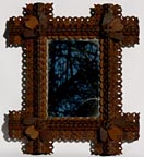 Tramp art frame with hearts