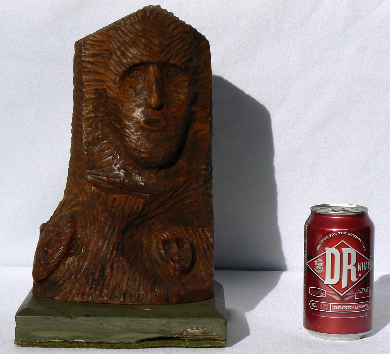Carved bust on stone base