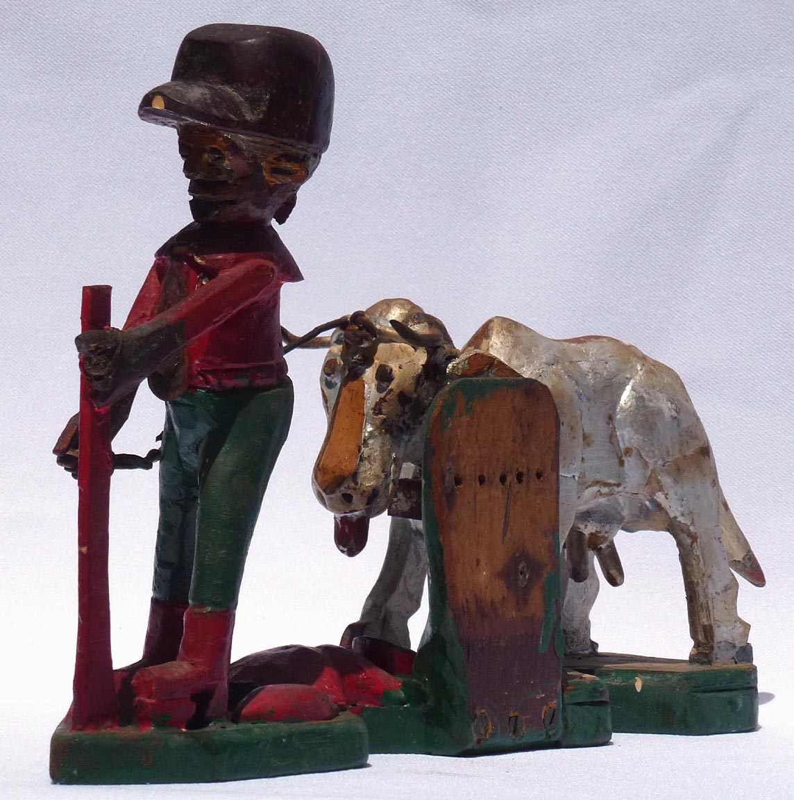Carving of man with cow by Mr. Benjamin