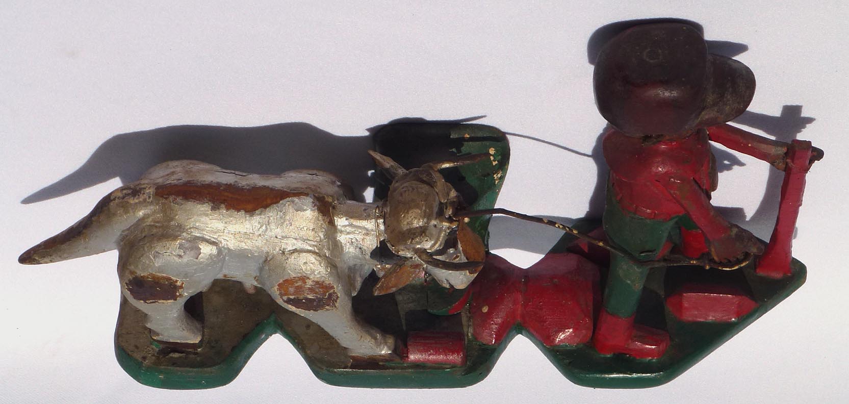 Carving of man with cow by Mr. Benjamin