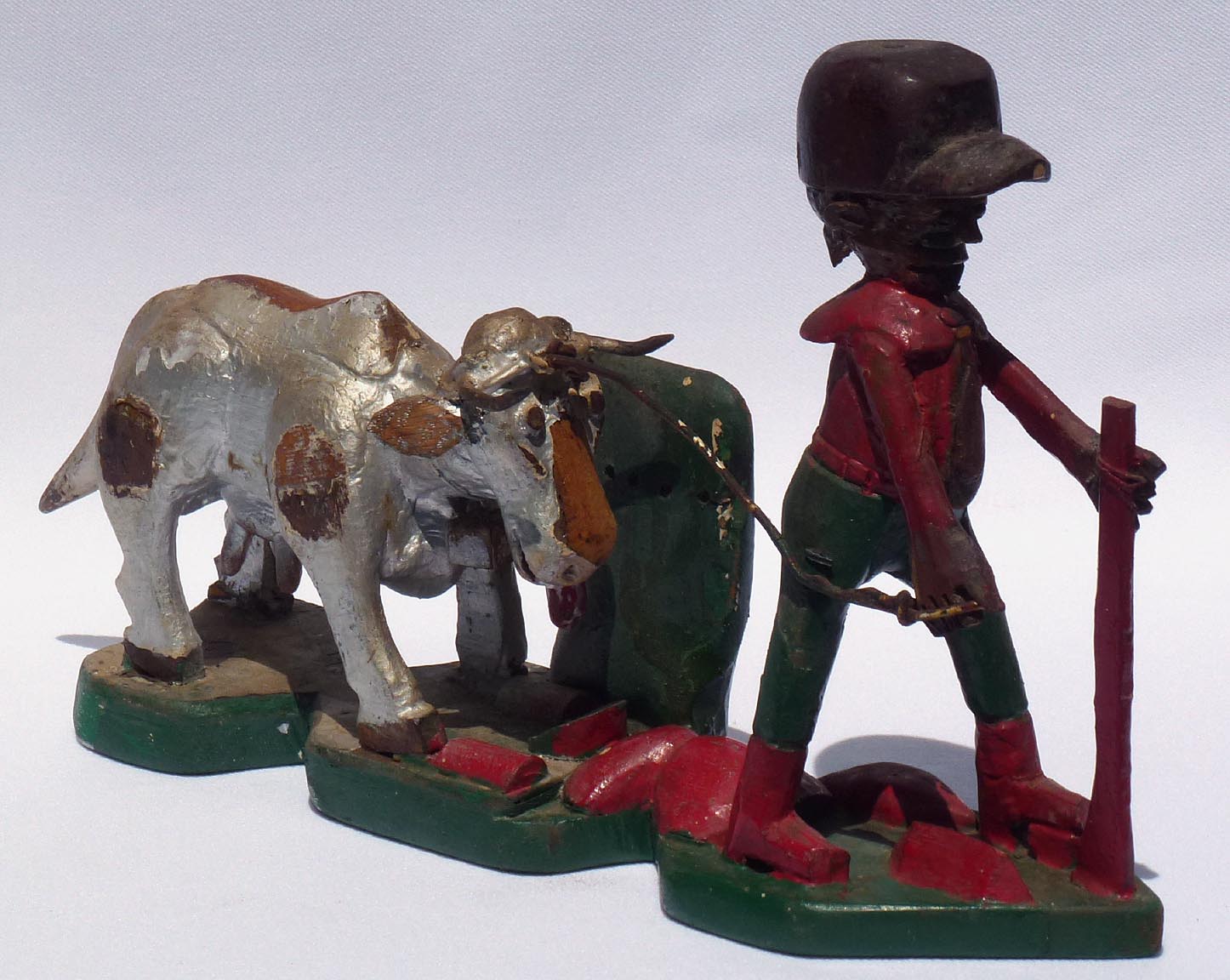 Carving of man with cow by Mr. Benjamin