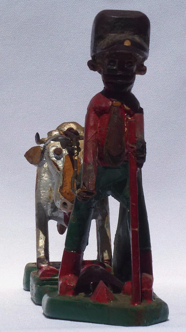 Carving of man with cow by Mr. Benjamin