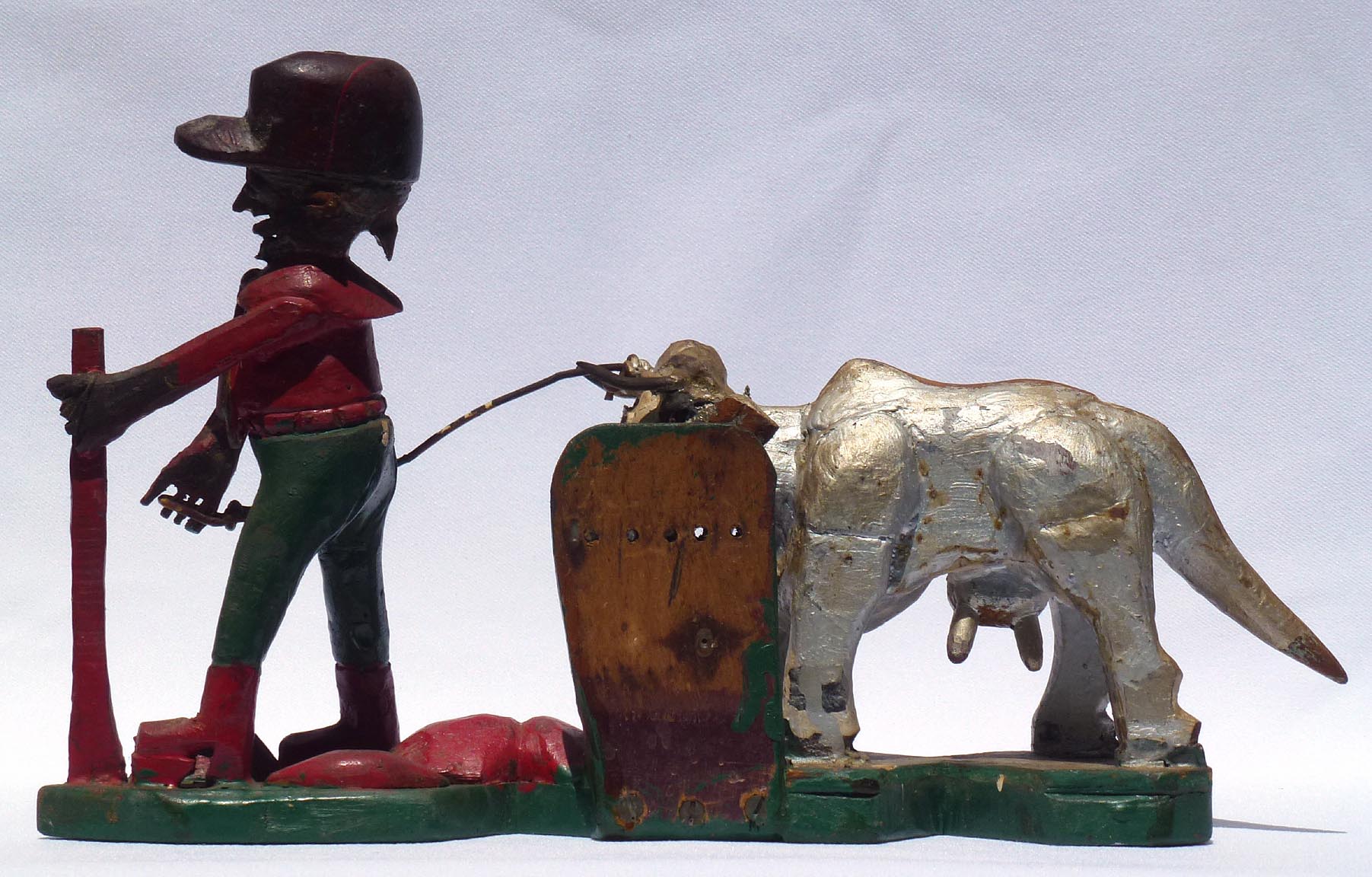 Carving of man with cow by Mr. Benjamin