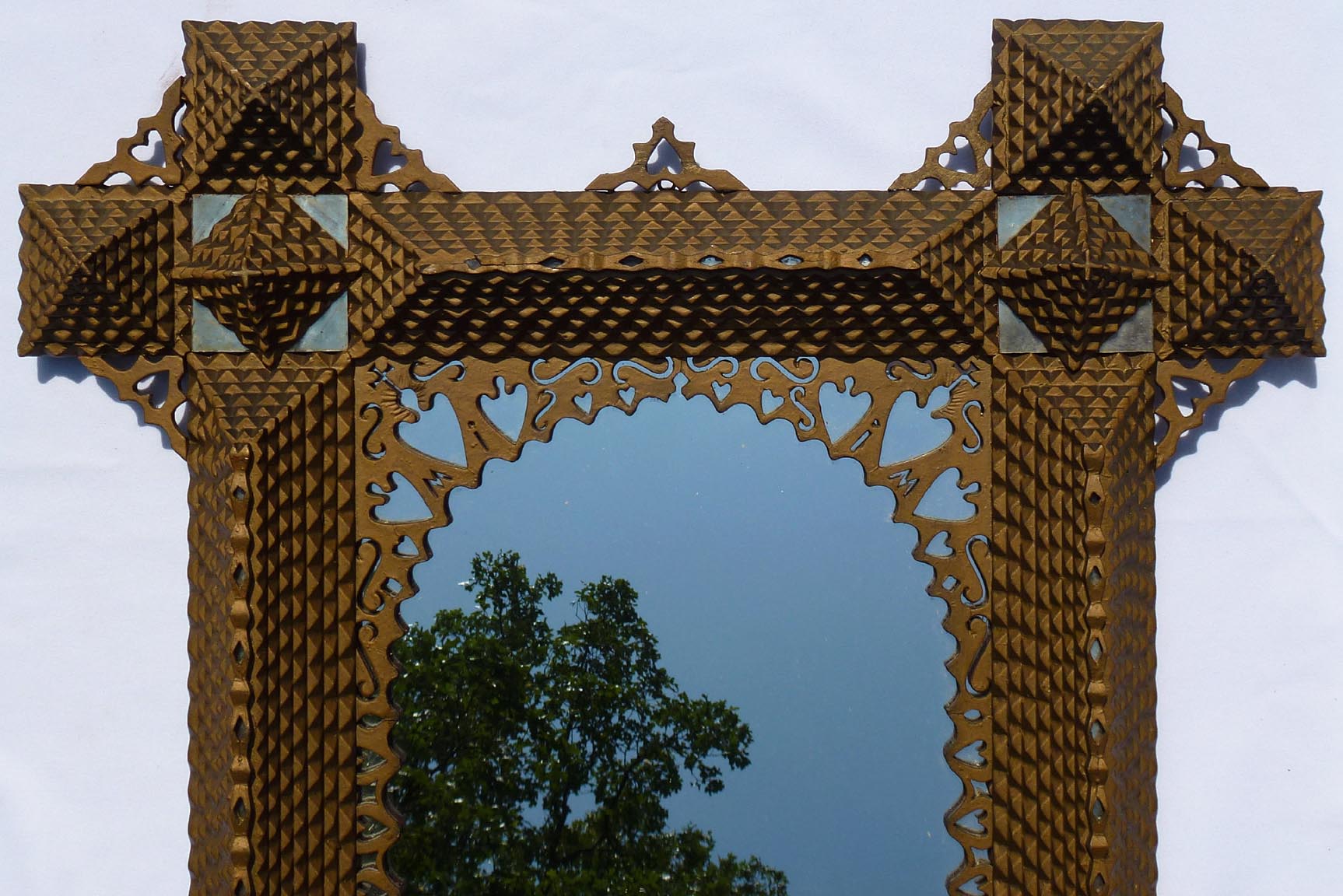 Large, intricate tramp art frame