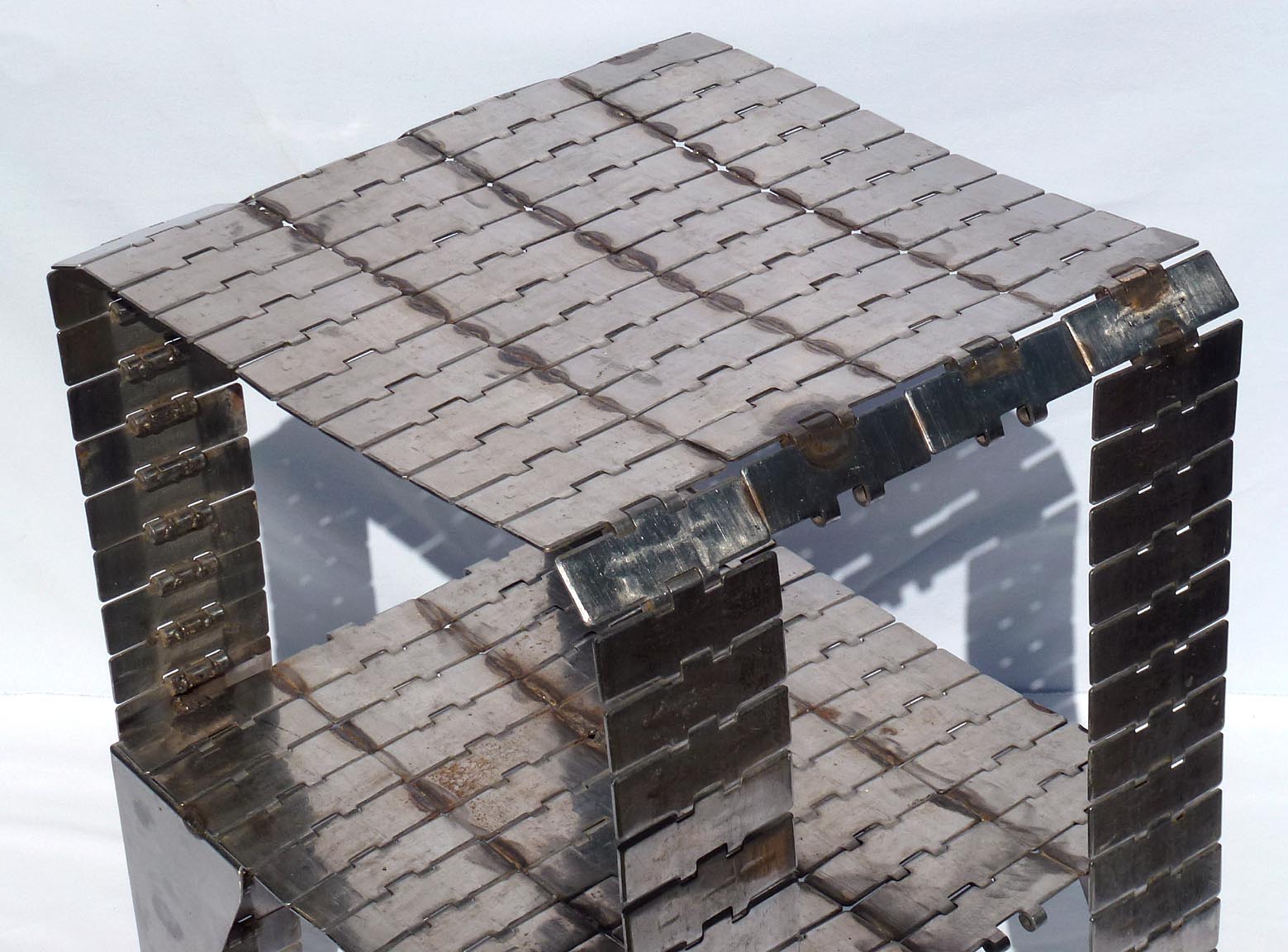 Metal table made from industrial conveyor belt