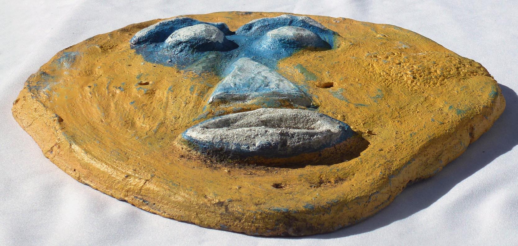 Outsider art concrete faces