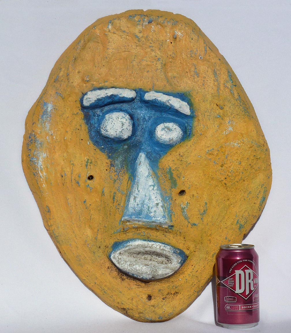 Outsider art concrete faces