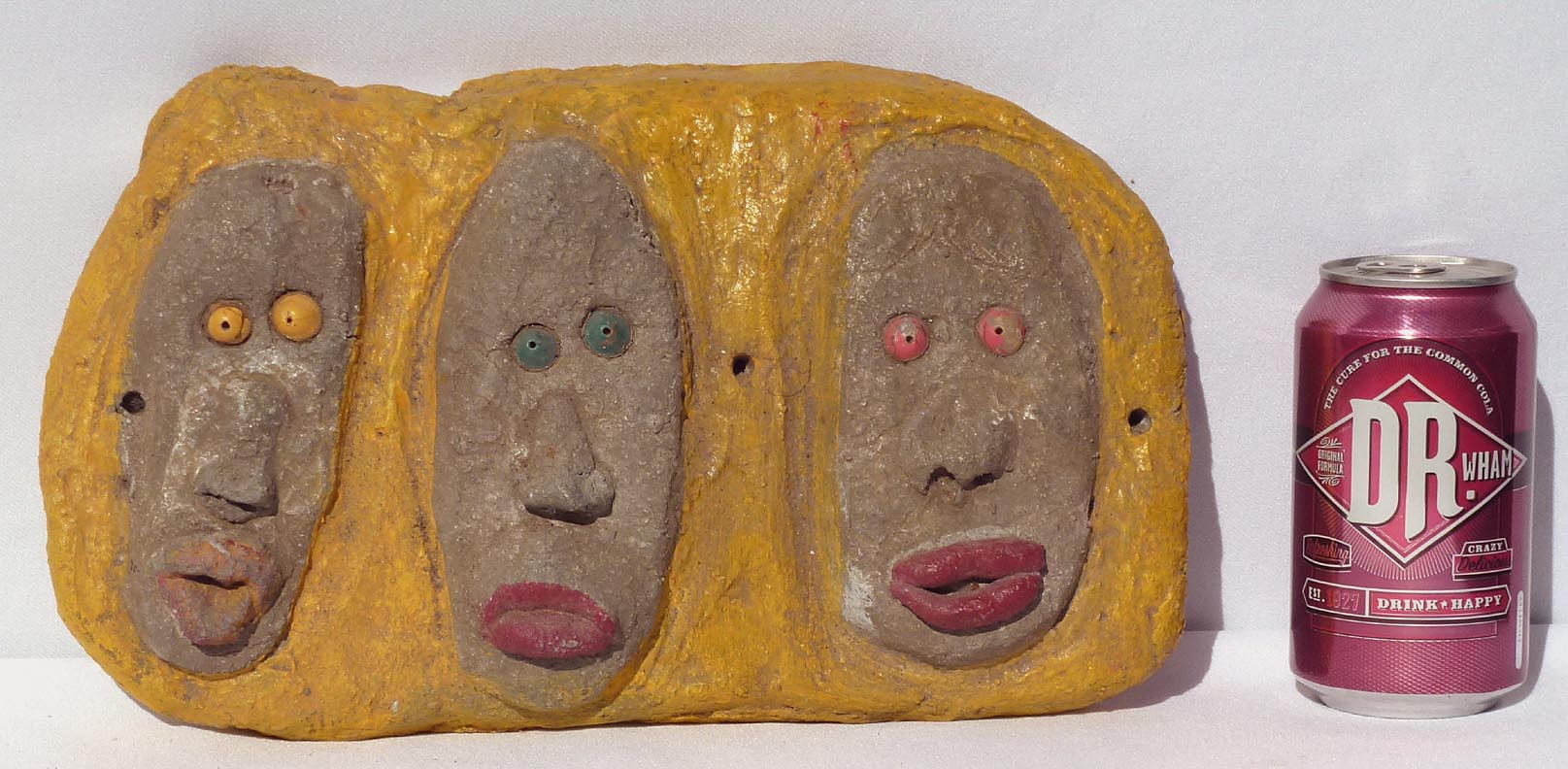 Outsider art concrete faces