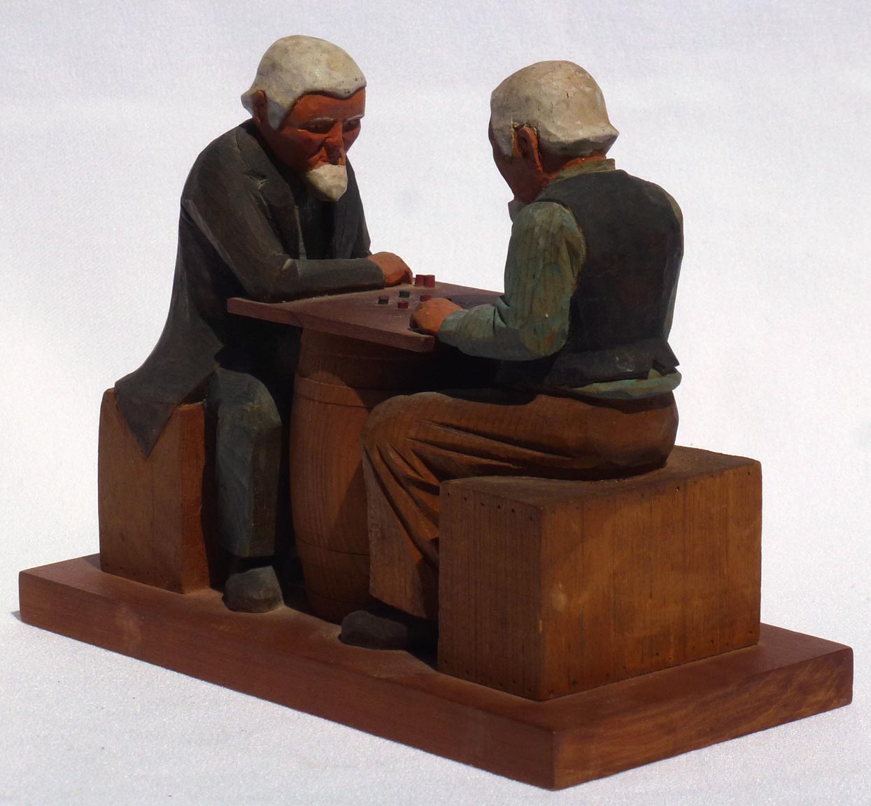 Carving of men playing checkers
