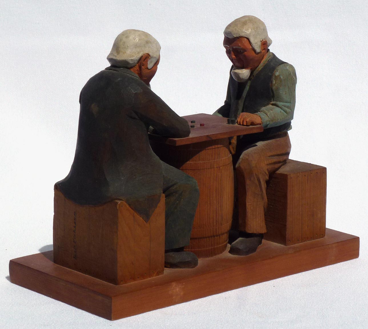 Carving of men playing checkers