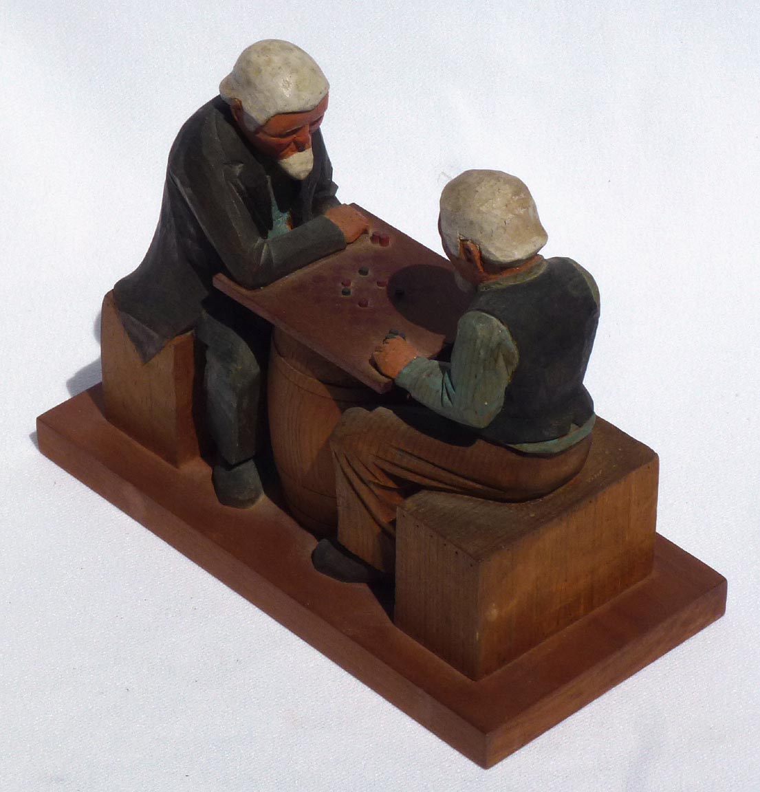 Carving of men playing checkers