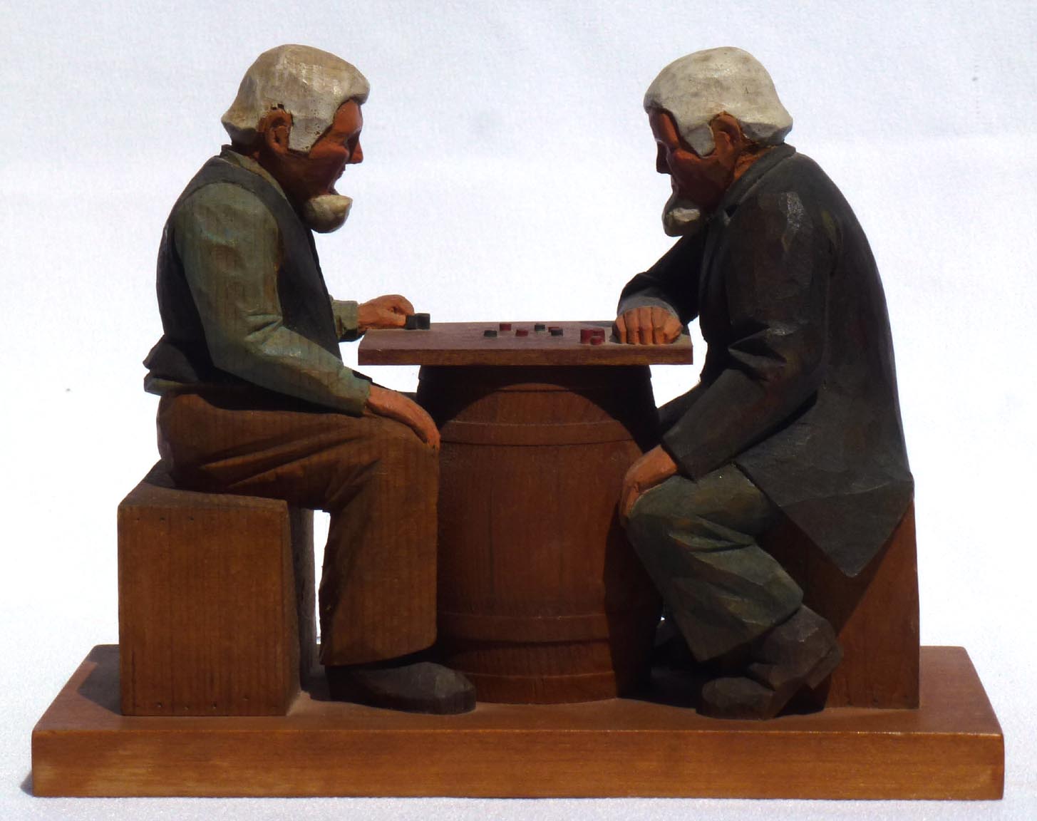 Carving of men playing checkers