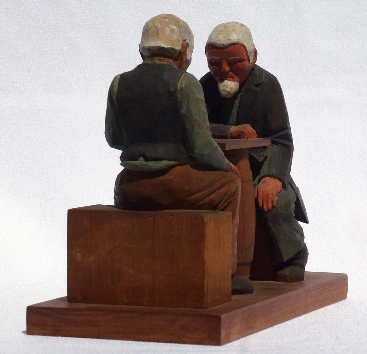 Carving of men playing checkers