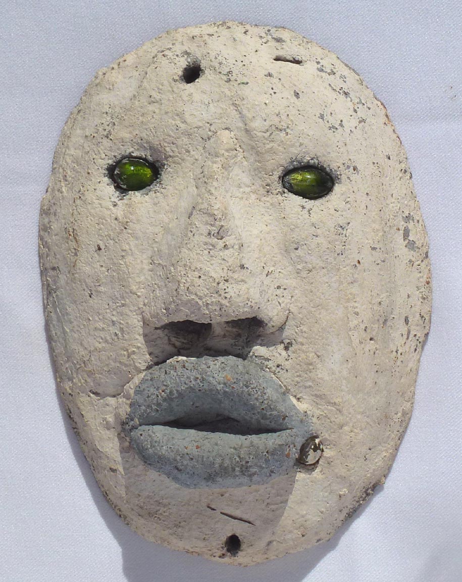 Outsider art concrete faces