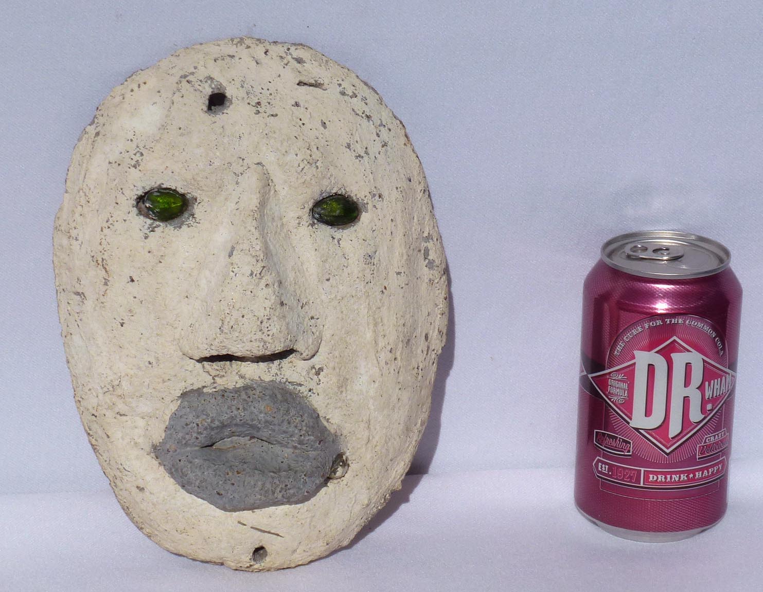 Outsider art concrete faces