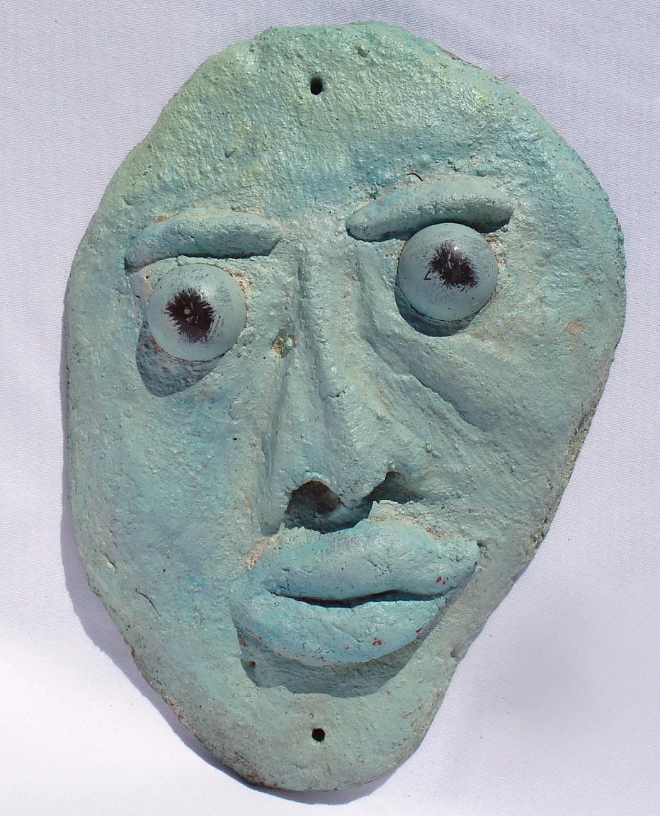 Outsider art concrete faces