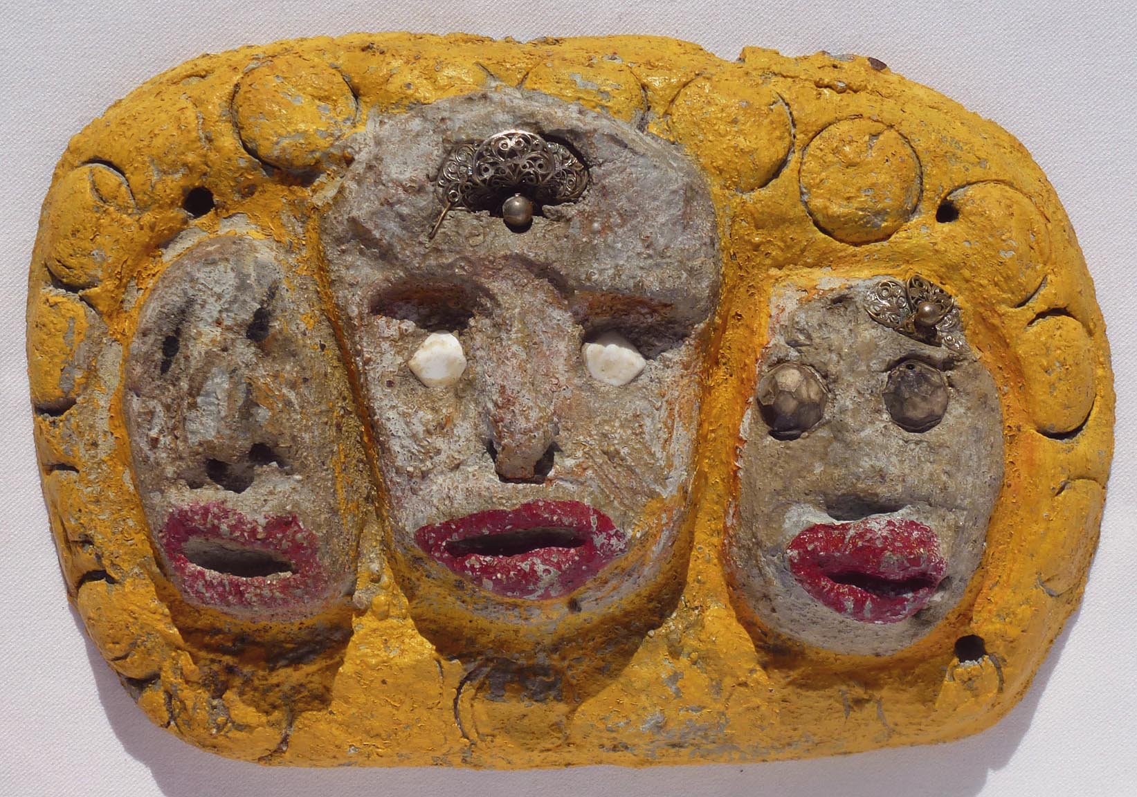 Outsider art concrete faces