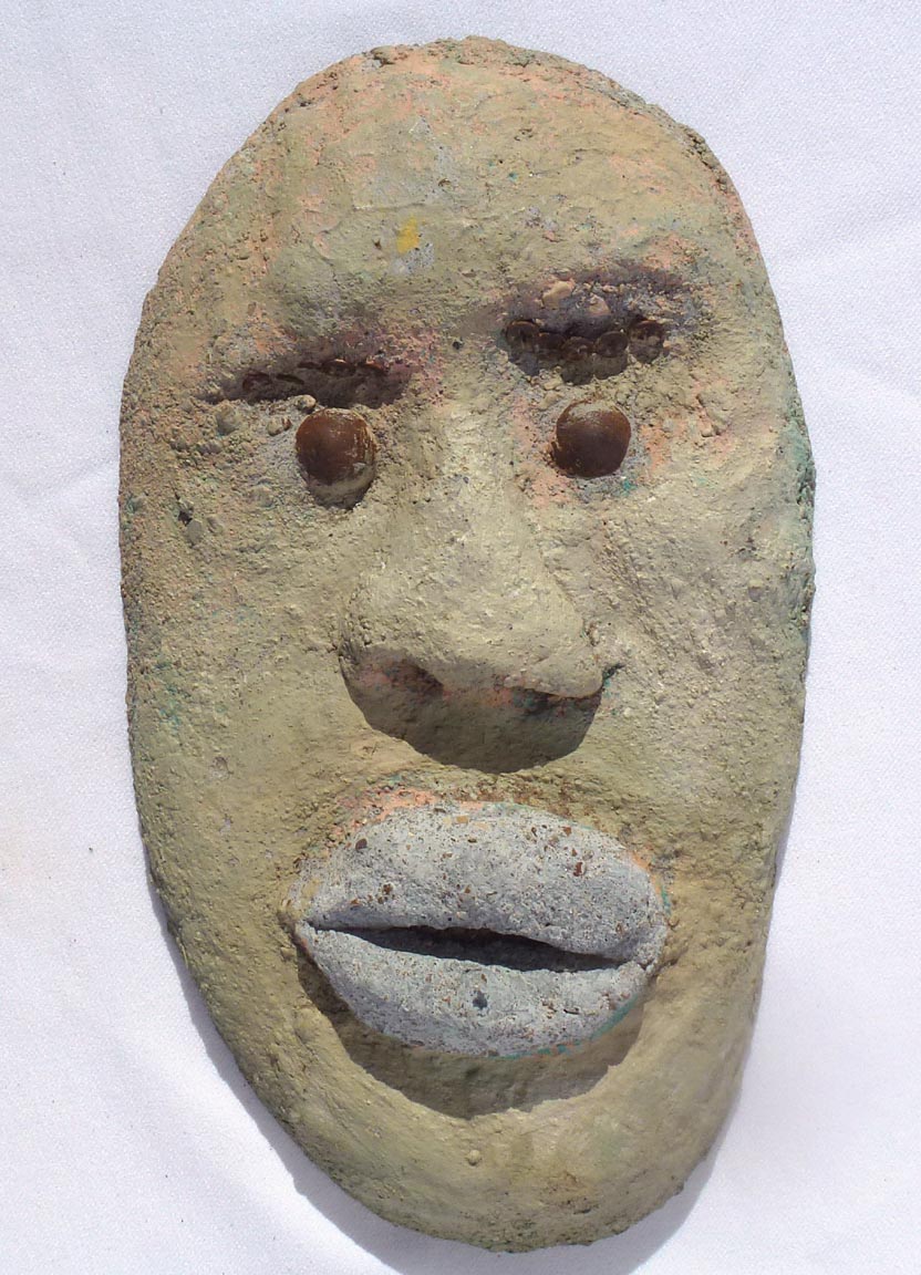 Outsider art concrete faces