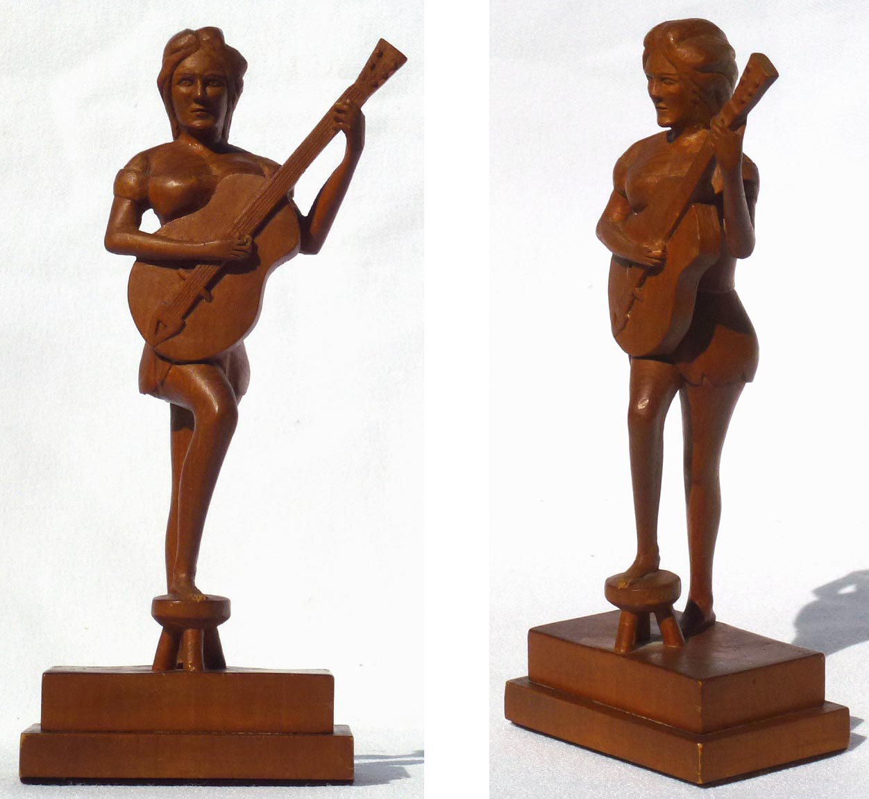 Carving of a woman playing guitar