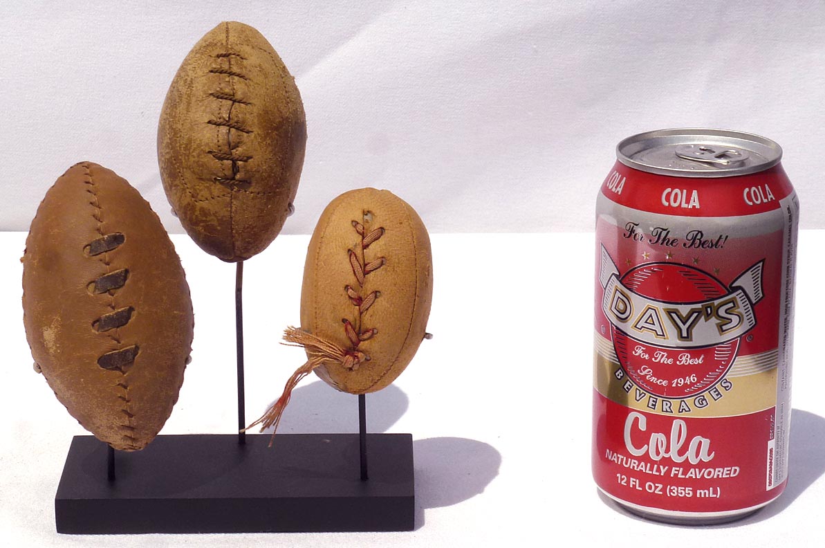 Three hand made miniature footballs